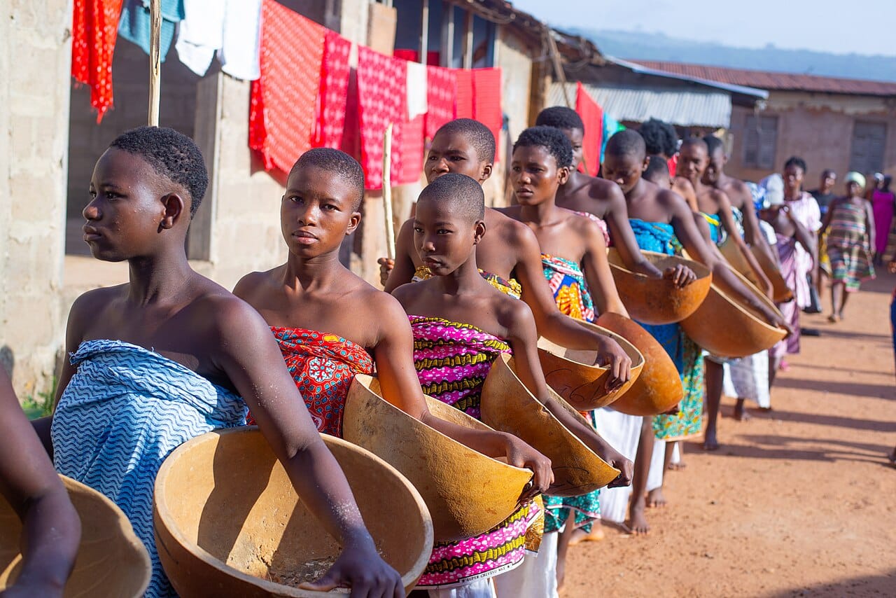 Participants at the conclusion of an initiation. The public return, rather than the seclusion, is what confers the new status.