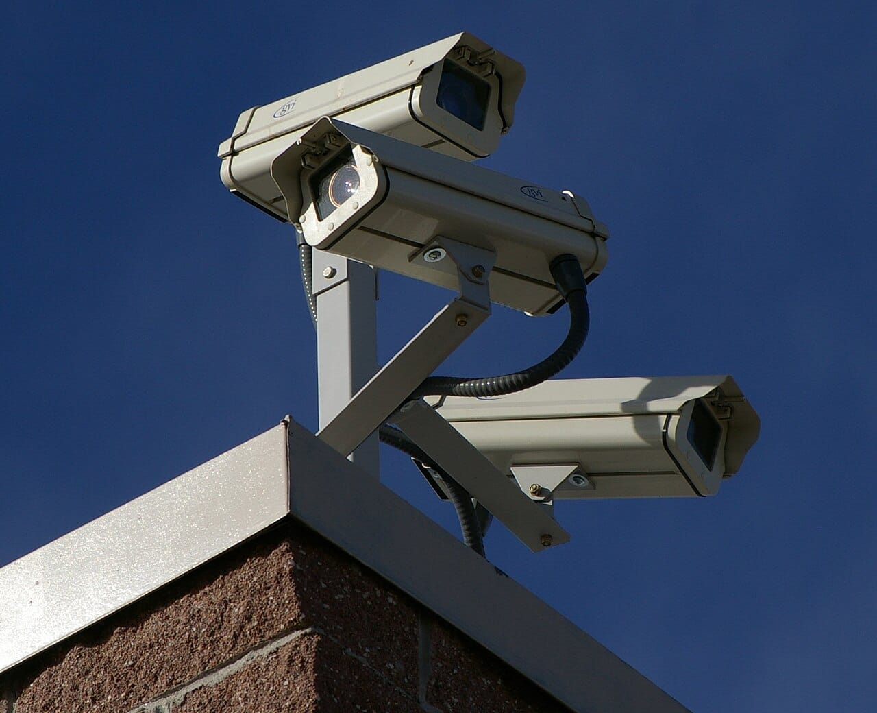 Surveillance cameras. Guardianship can be supplied by people, by design or by technology, and the theory treats these as interchangeable in principle.