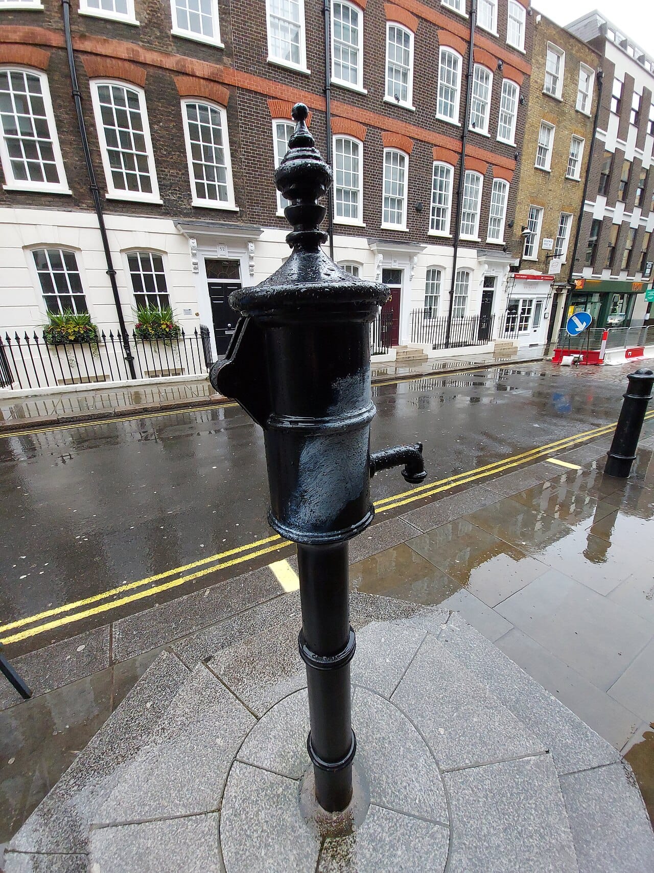 The replica pump marking the Broad Street outbreak. Removing the handle is the founding story of epidemiology, though the outbreak was already declining when it happened.