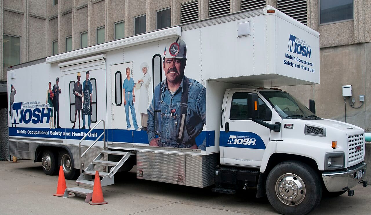 A mobile screening unit. Reaching people who would not otherwise attend is a large part of whether a programme achieves what its trials showed.