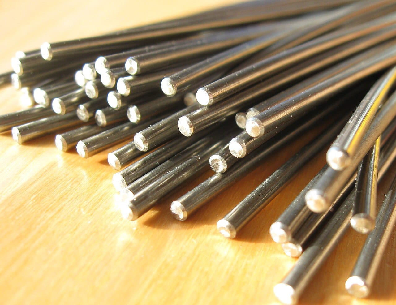 Nitinol wire, an alloy of roughly equal nickel and titanium. Its transformation temperature can be tuned by small changes in composition, which is what makes it usable across so many applications.