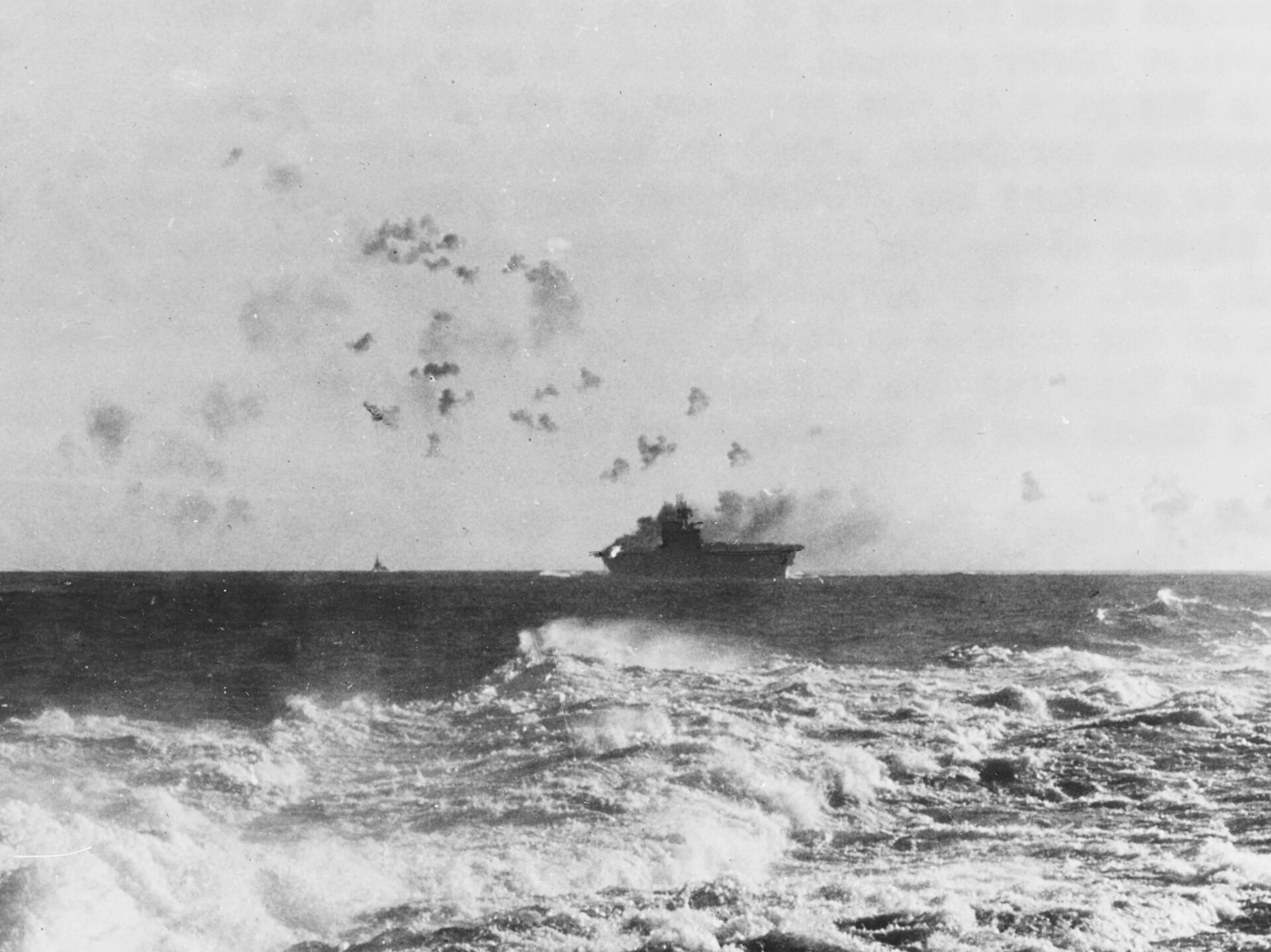 The American aircraft carrier USS Enterprise under Japanese air attack in the waters off the Solomons in 1942. So many ships sank in the naval battles here that the strait became known as Ironbottom Sound.