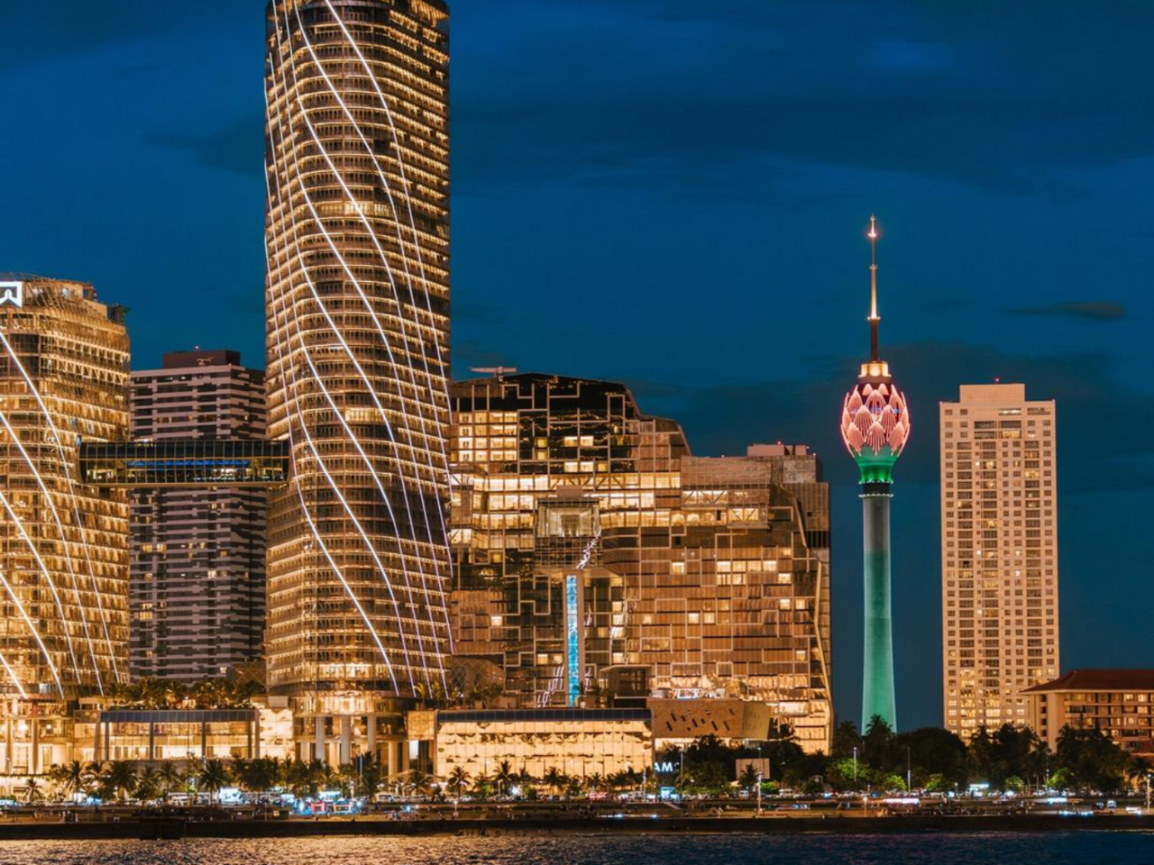 The skyline of Colombo, the commercial capital and largest city of Sri Lanka, lit at night. The port city is the financial heart of the island and a hub on the shipping lanes of the Indian Ocean.