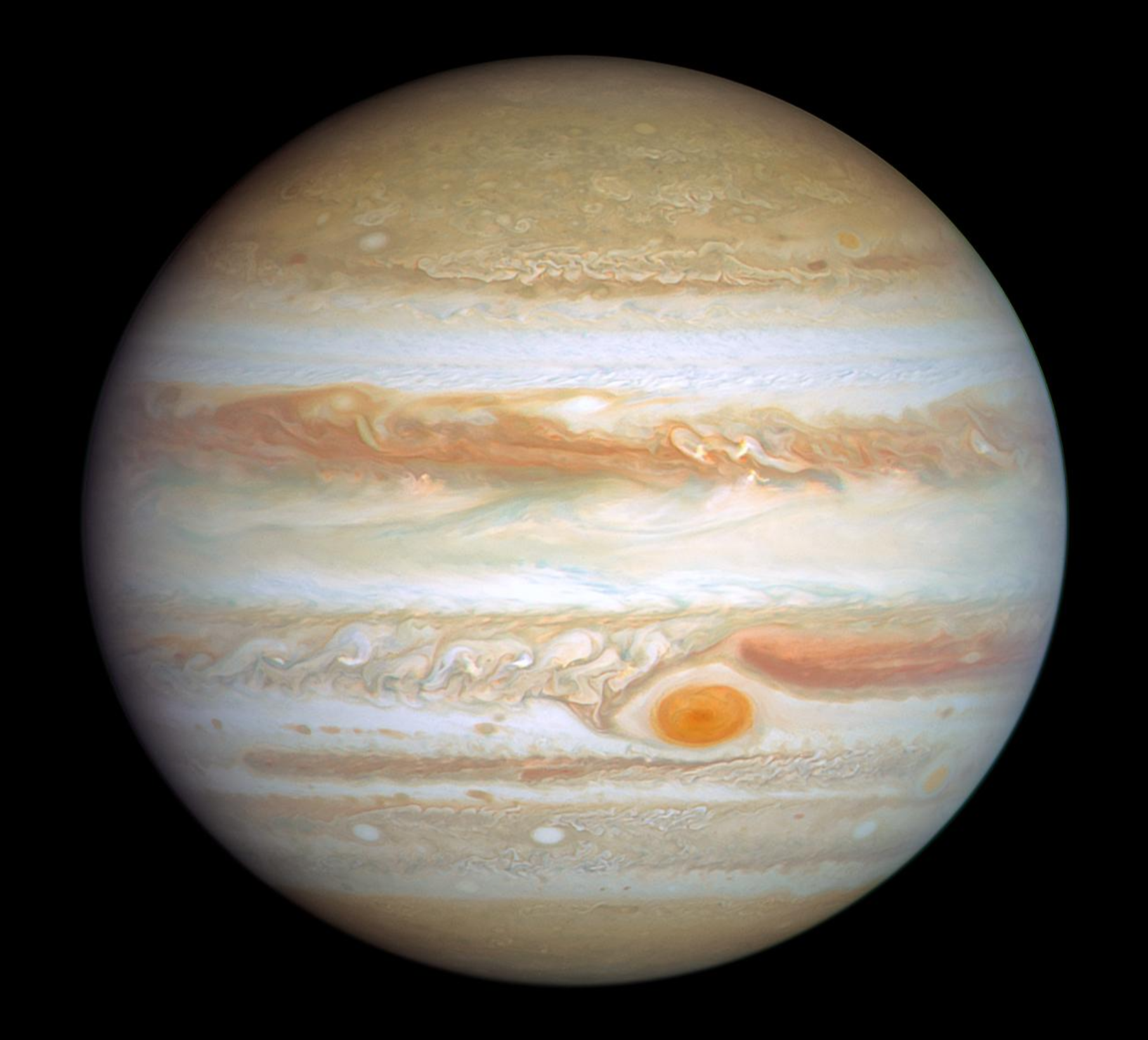 Jupiter, the largest planet, its banded clouds marked by the Great Red Spot.