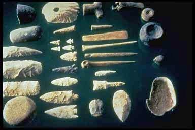 Worked stone implements. Deliberate flaking leaves distinctive scars that distinguish a tool from a naturally broken rock.