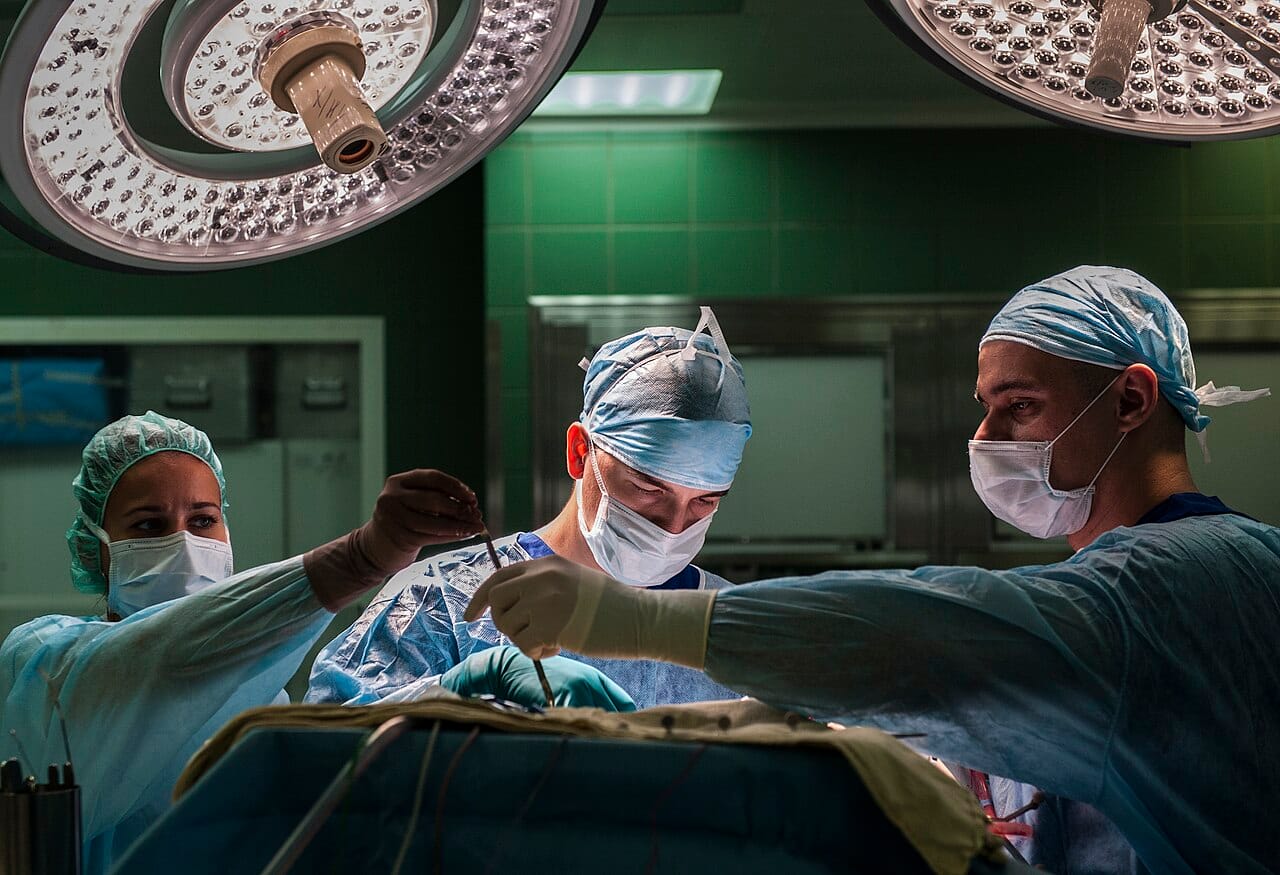 Contemporary operating theatre practice. A modern operation involves a team, imaging, monitoring and anaesthesia as much as it involves cutting.