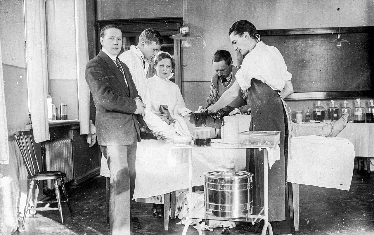 A hospital operating theatre of the early twentieth century. Aseptic technique, in which everything entering the field is sterile, replaced spraying antiseptic during the operation.