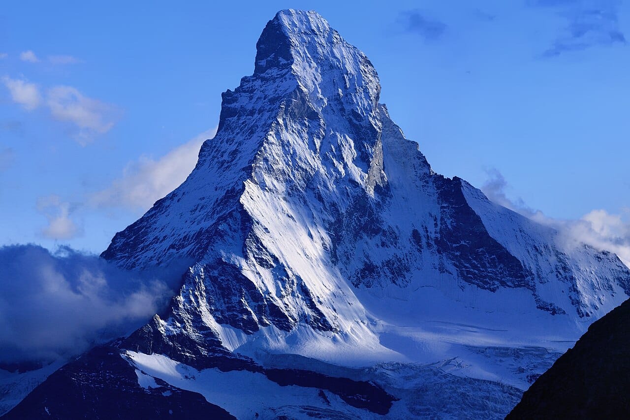 The Matterhorn, the pyramid-shaped peak on the Italian border that is the emblem of the Swiss Alps. Mountains cover most of the country, shaping its history, its identity, and its tourism.