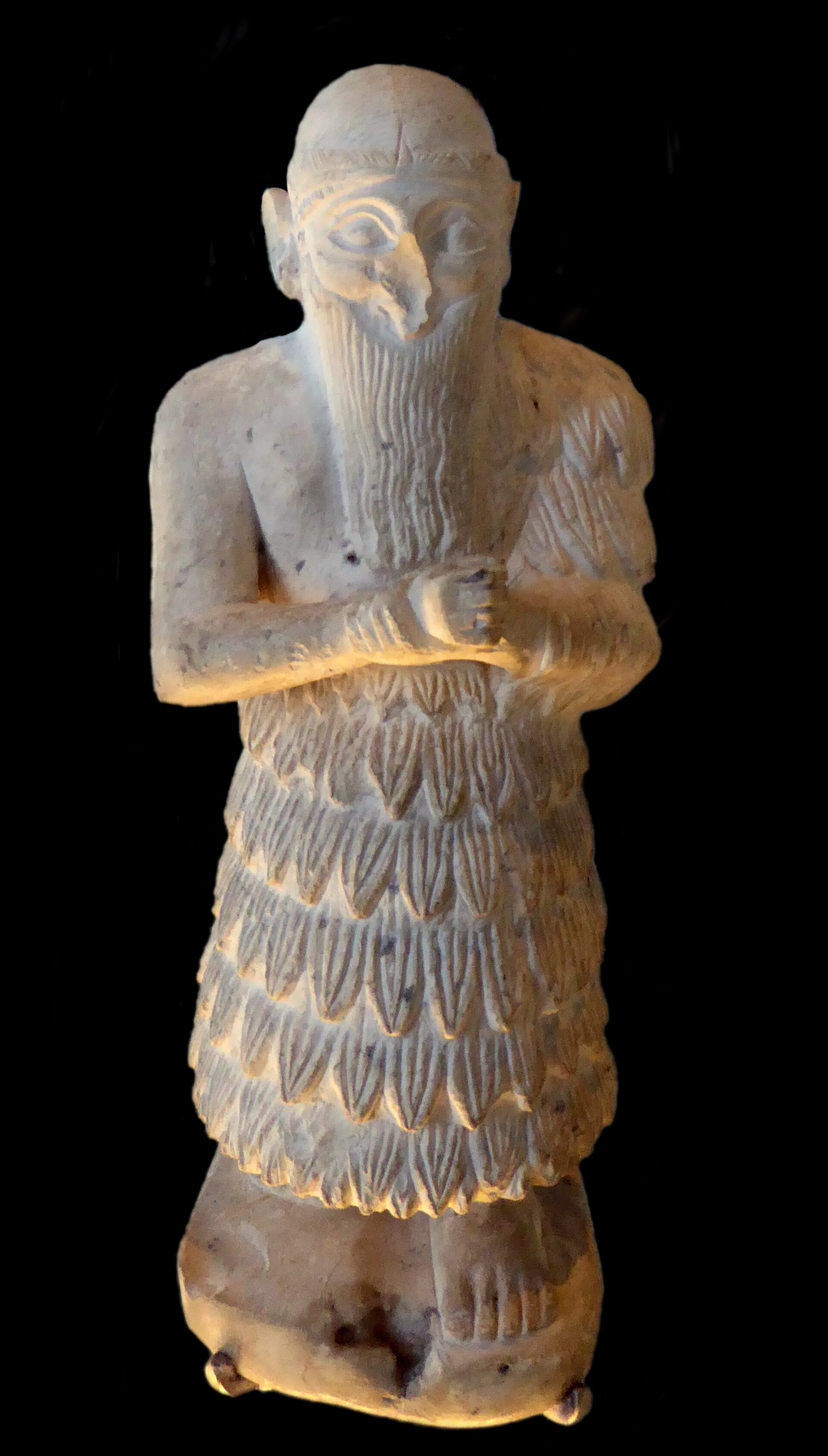 A votive statue of Ishqi-Mari, a king of the city-state of Mari on the Euphrates, made around 2500 BC. Mari was one of the great cities of early Mesopotamia and its ruins have yielded thousands of clay tablets.