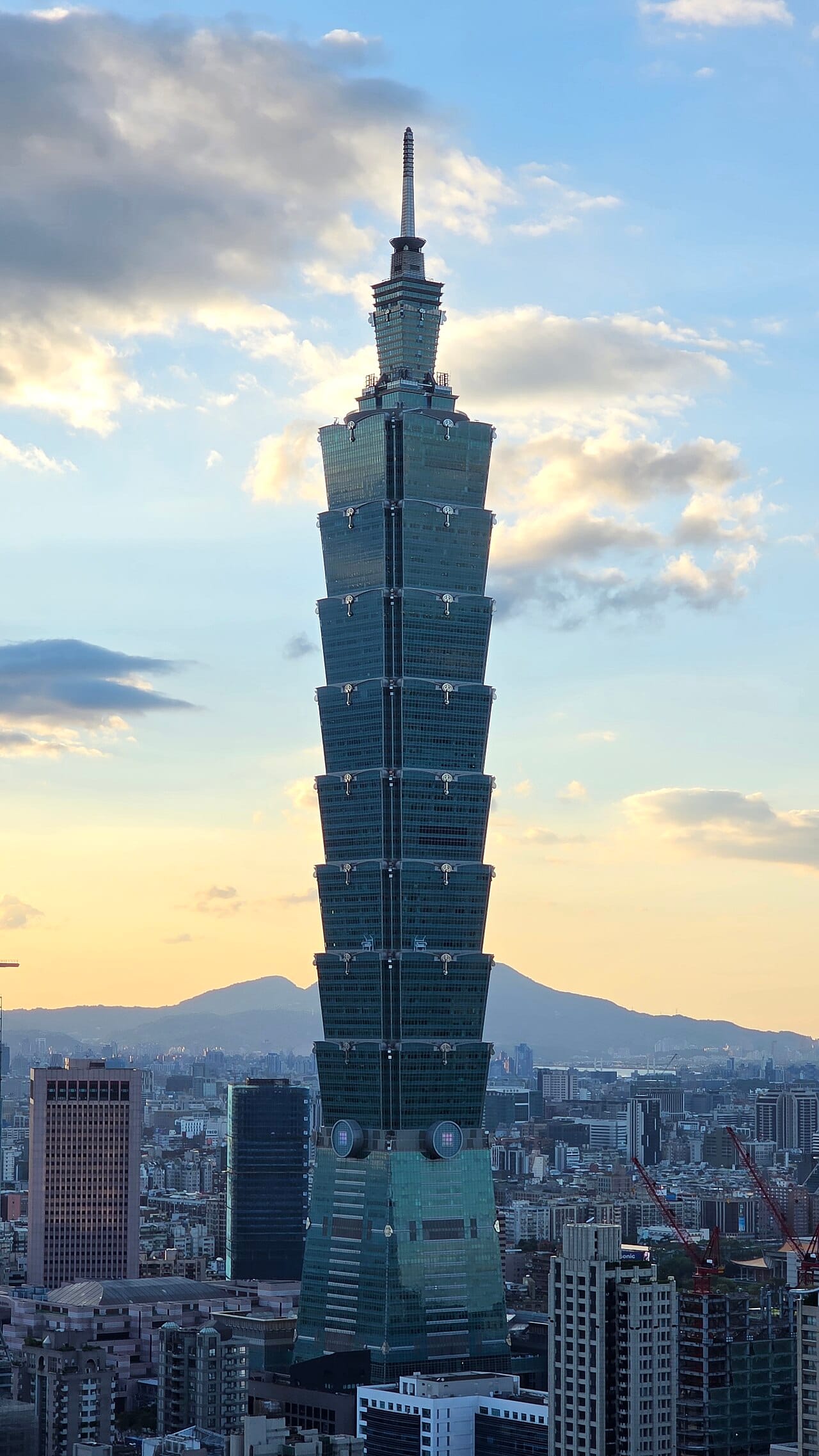 Taipei 101 above the capital. Briefly the tallest building in the world, it stands in a country where more than three quarters of the population lives on the western plain and which now faces one of the lowest birth rates on Earth.