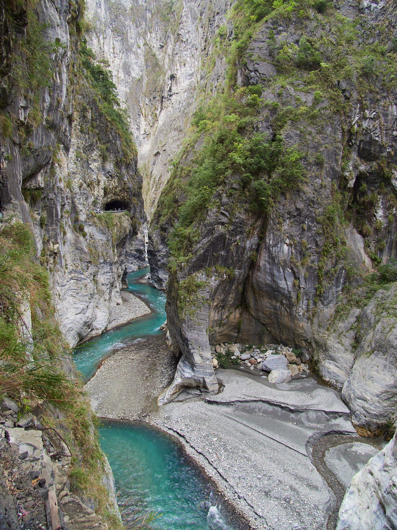 Taroko Gorge on the east coast, cut through marble by the Liwu River. Taiwan's mountains, thrown up where the Philippine Sea Plate meets the Eurasian Plate, hold more than two hundred peaks above three thousand metres.