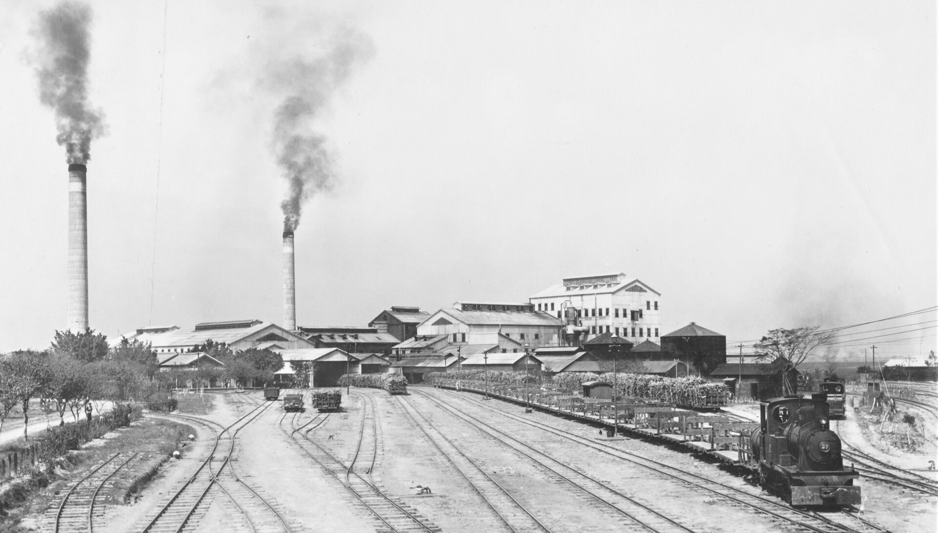 A sugar factory in 1930s Taiwan. Fifty years of Japanese colonial rule brought railways, ports, schools, and industry alongside political subordination and assimilation campaigns, and left an infrastructure base that shaped the island's later development.