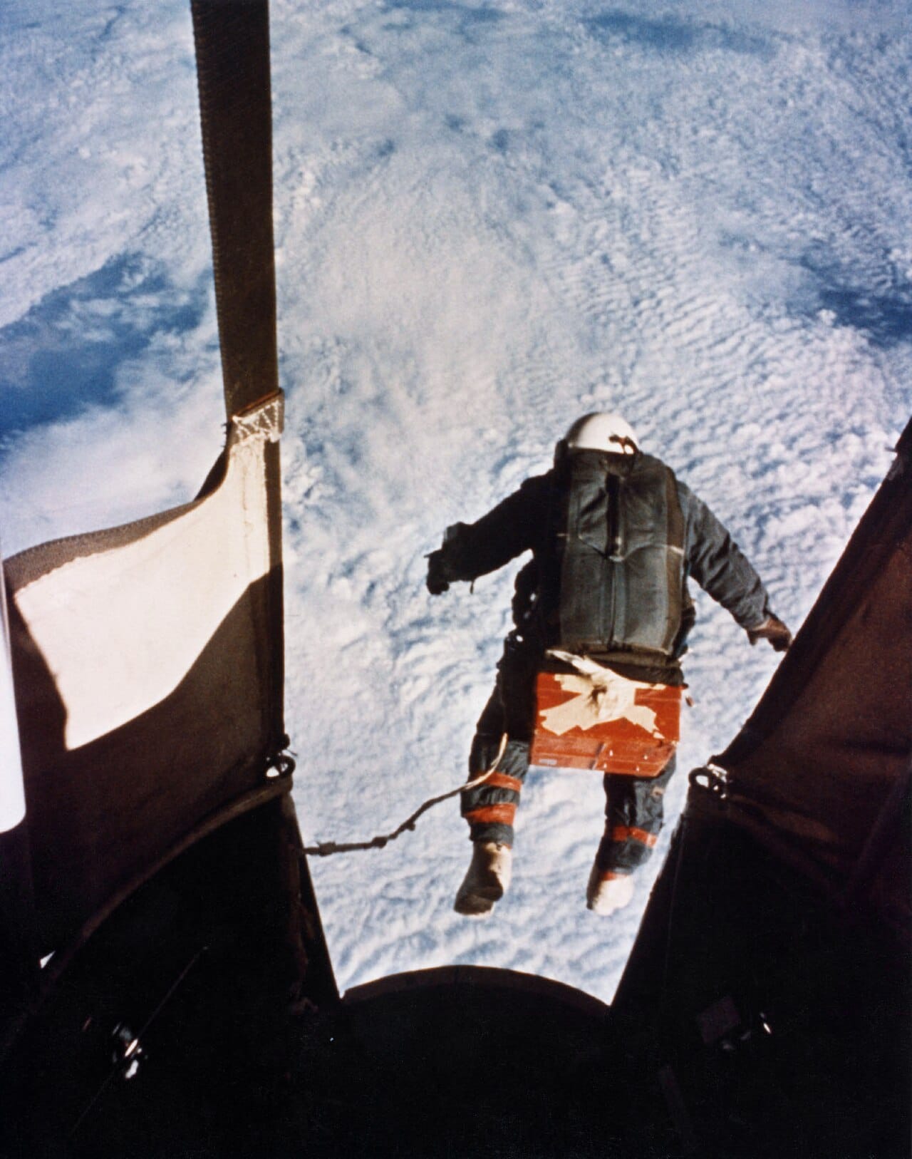 A high-altitude jump from the stratosphere. Above the troposphere a pressure suit is required, since the air is too thin to support consciousness or to keep body fluids liquid.