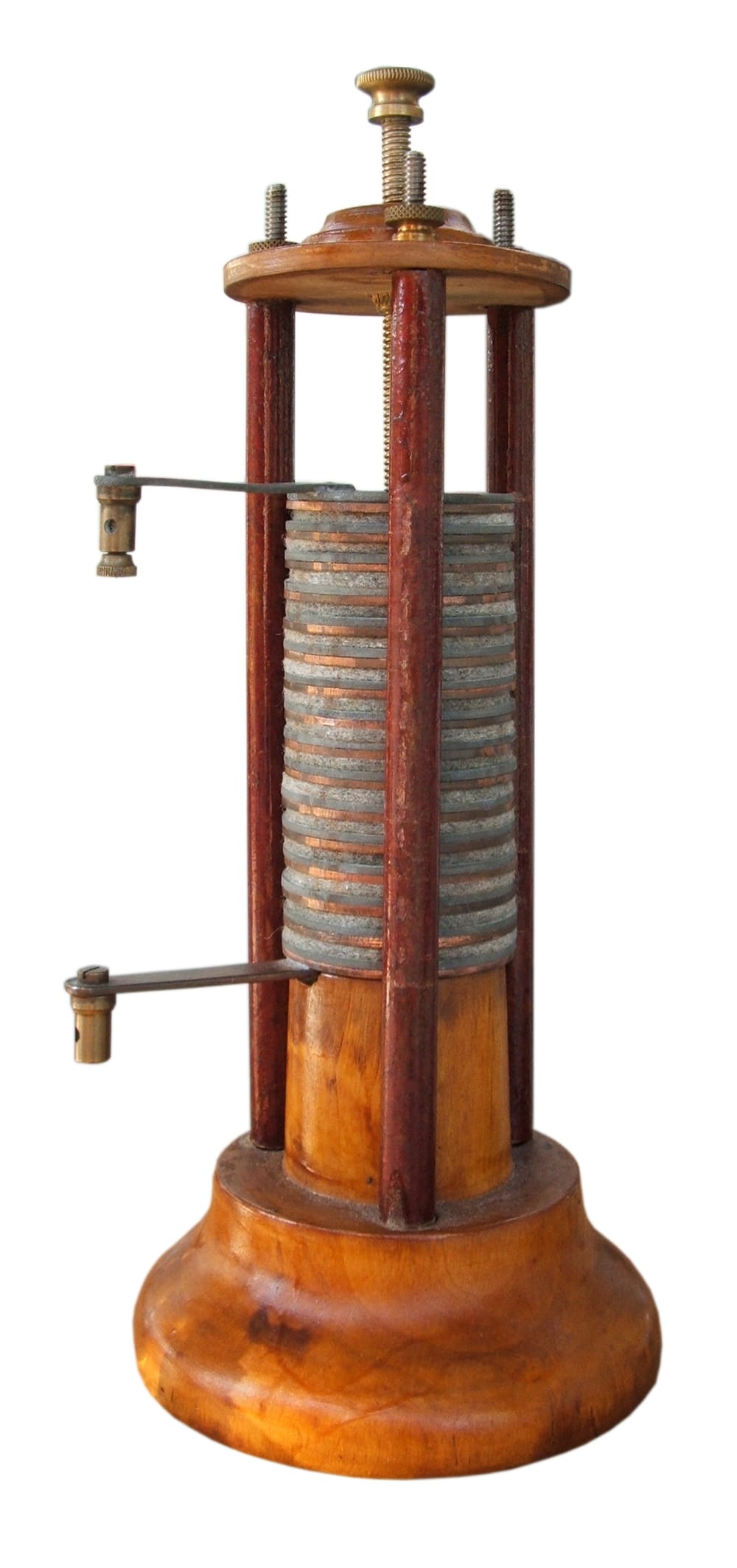 Volta's pile, the first battery. Alternating discs of two metals separated by brine-soaked cloth produced a continuous current, which no previous device had.