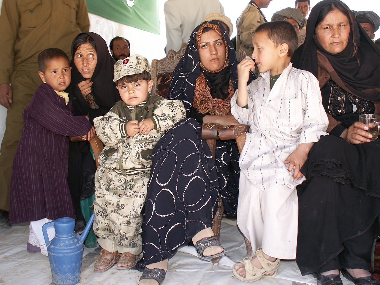 An extended family group. Multi-generational households remain the majority arrangement in much of the world and were common historically in the West.