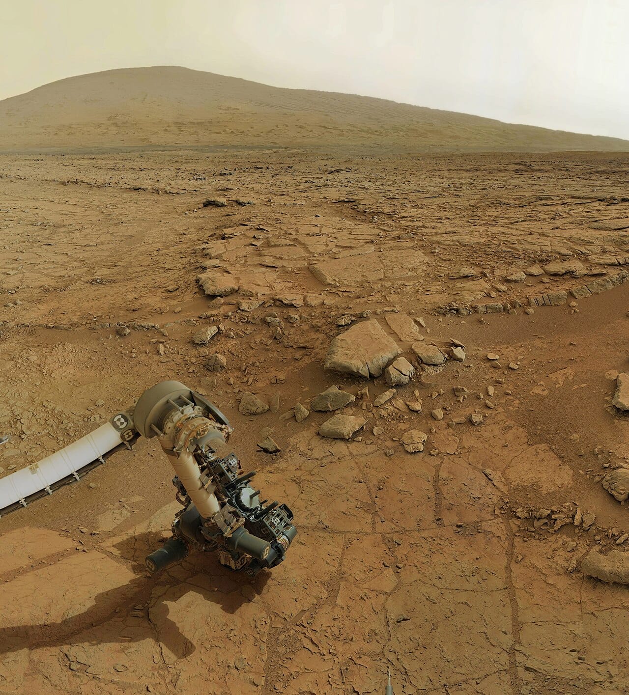 A rover drilling on Mars. Subsurface environments are shielded from radiation and from atmospheric loss, and they fall outside the surface-based definition of the zone entirely.