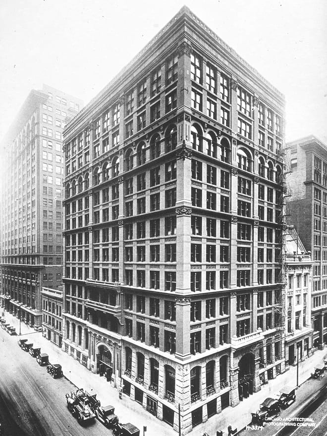 The Home Insurance Building in Chicago, completed in 1885. It is conventionally identified as the first skyscraper because its frame rather than its walls carried the load.
