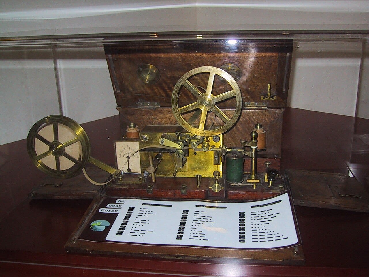 Morse's apparatus. A single wire, a single key and a code made of two symbols proved simpler and cheaper than pointing at letters, and it won.
