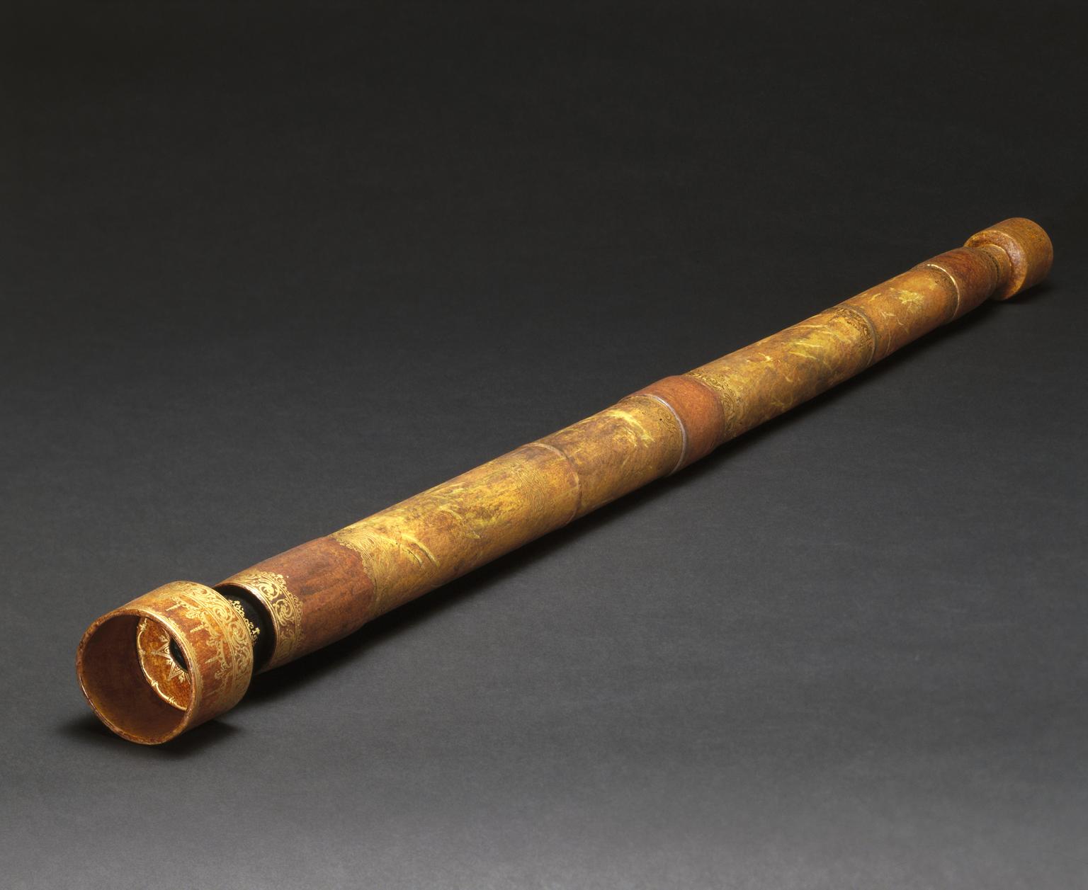 A replica of one of the earliest surviving telescopes, from the 1600s.