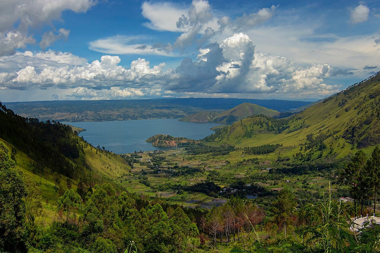 Lake Toba, the caldera left by the eruption. It is about a hundred kilometres long, and the scale of the collapse is not in dispute.