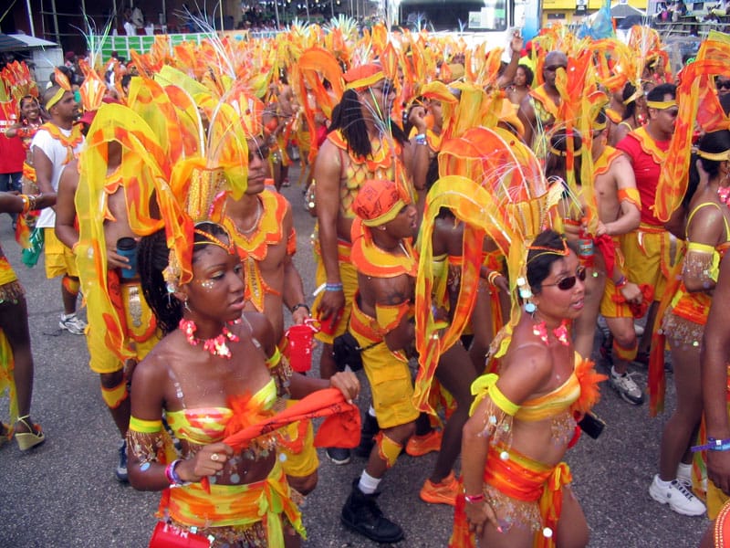 Masqueraders in elaborate costume at the Trinidad and Tobago Carnival, one of the greatest street festivals in the world. From this pre-Lenten celebration came calypso, soca, and the steelpan, a global cultural inheritance from a small nation.