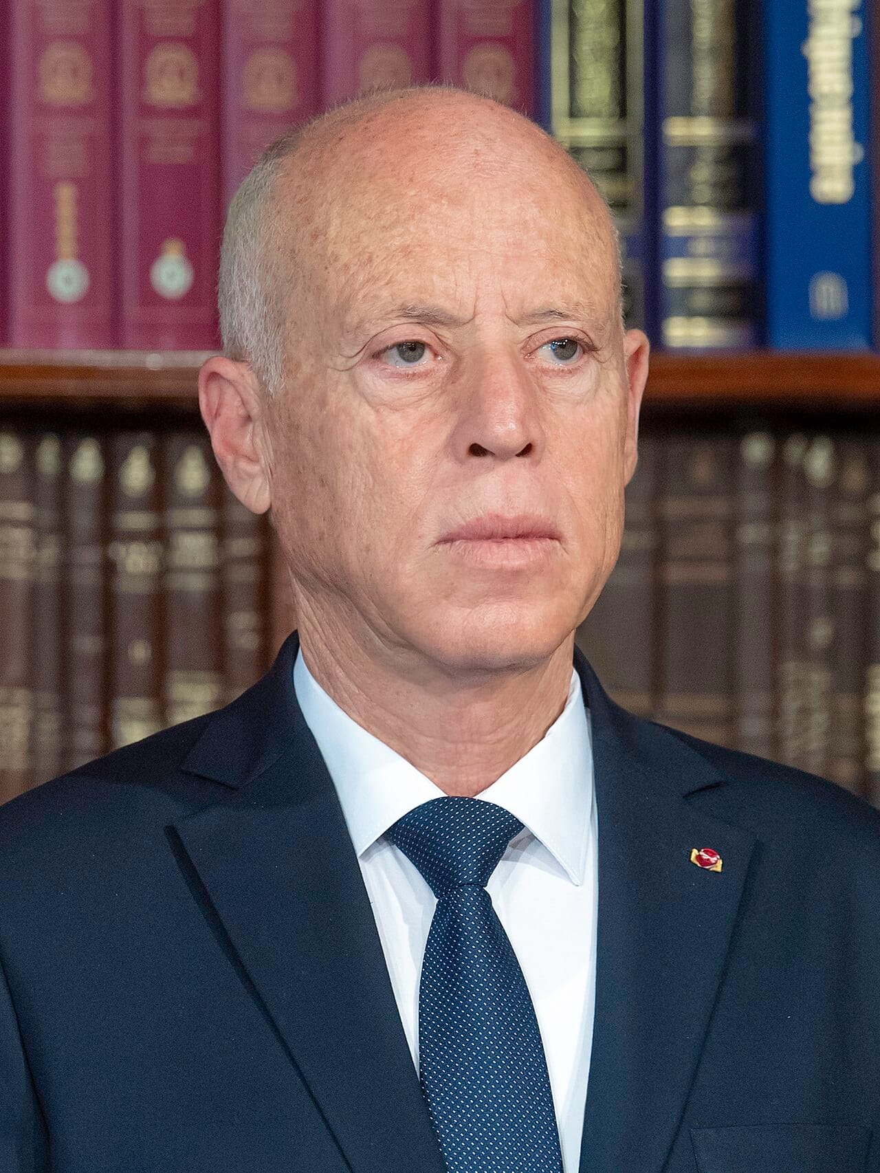 President Kais Saied. Elected as a political outsider in 2019, he suspended parliament in July 2021 and has since governed under a constitution, approved by referendum in 2022, that concentrates power in the presidency.