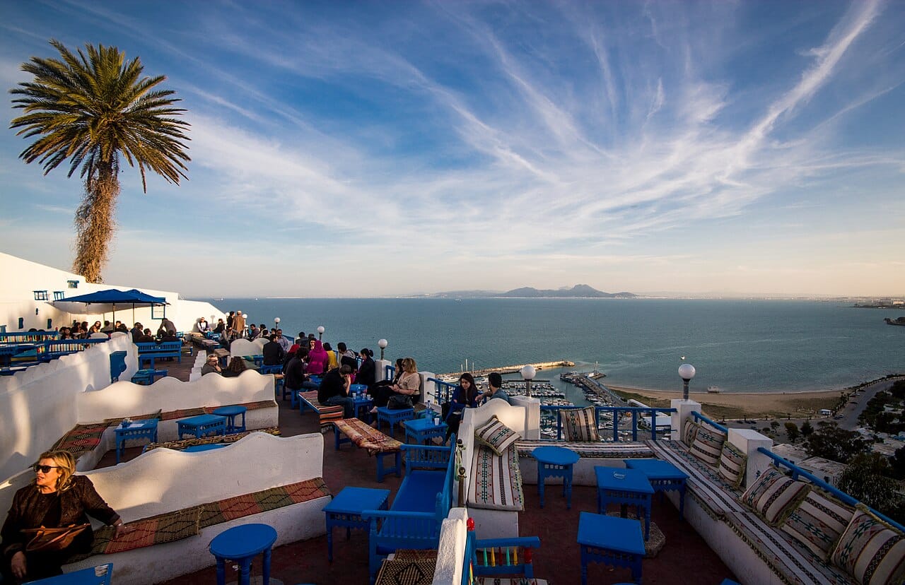 The blue and white village of Sidi Bou Said above the Gulf of Tunis. Its painted doors and shutters, fixed by a French baron's decree in the early twentieth century, have made it the country's most reproduced image and a magnet for artists.