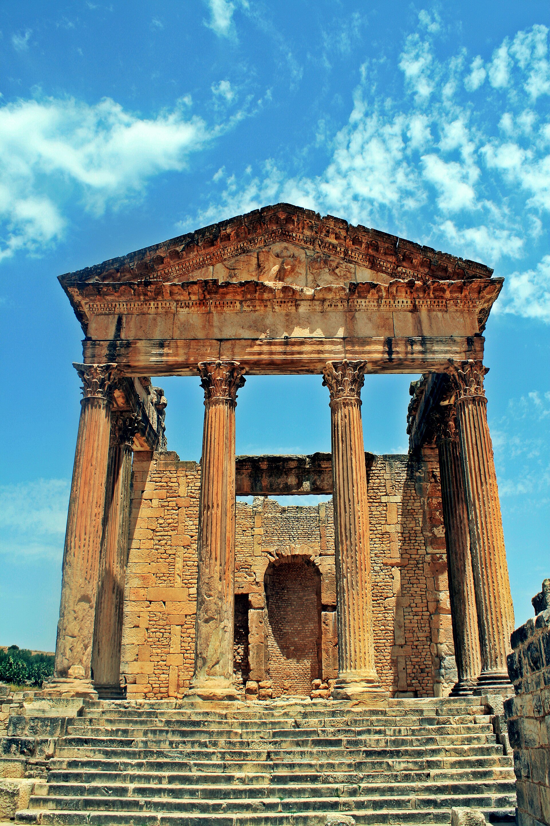 The well-preserved Roman ruins of Dougga, a reminder of the centuries when Tunisia was a rich Roman province. Credit: Slim Alileche (CC BY-SA 3.0).