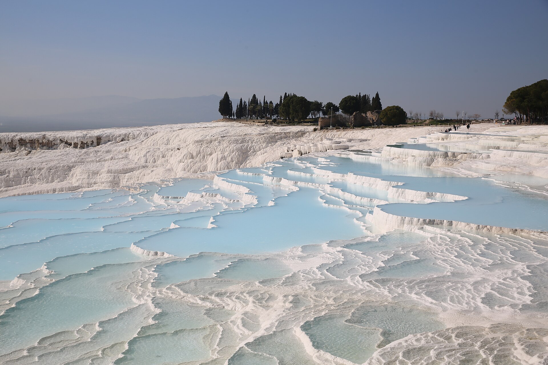 The white travertine terraces of Pamukkale, the 'cotton castle', formed over millennia by mineral-rich hot springs.