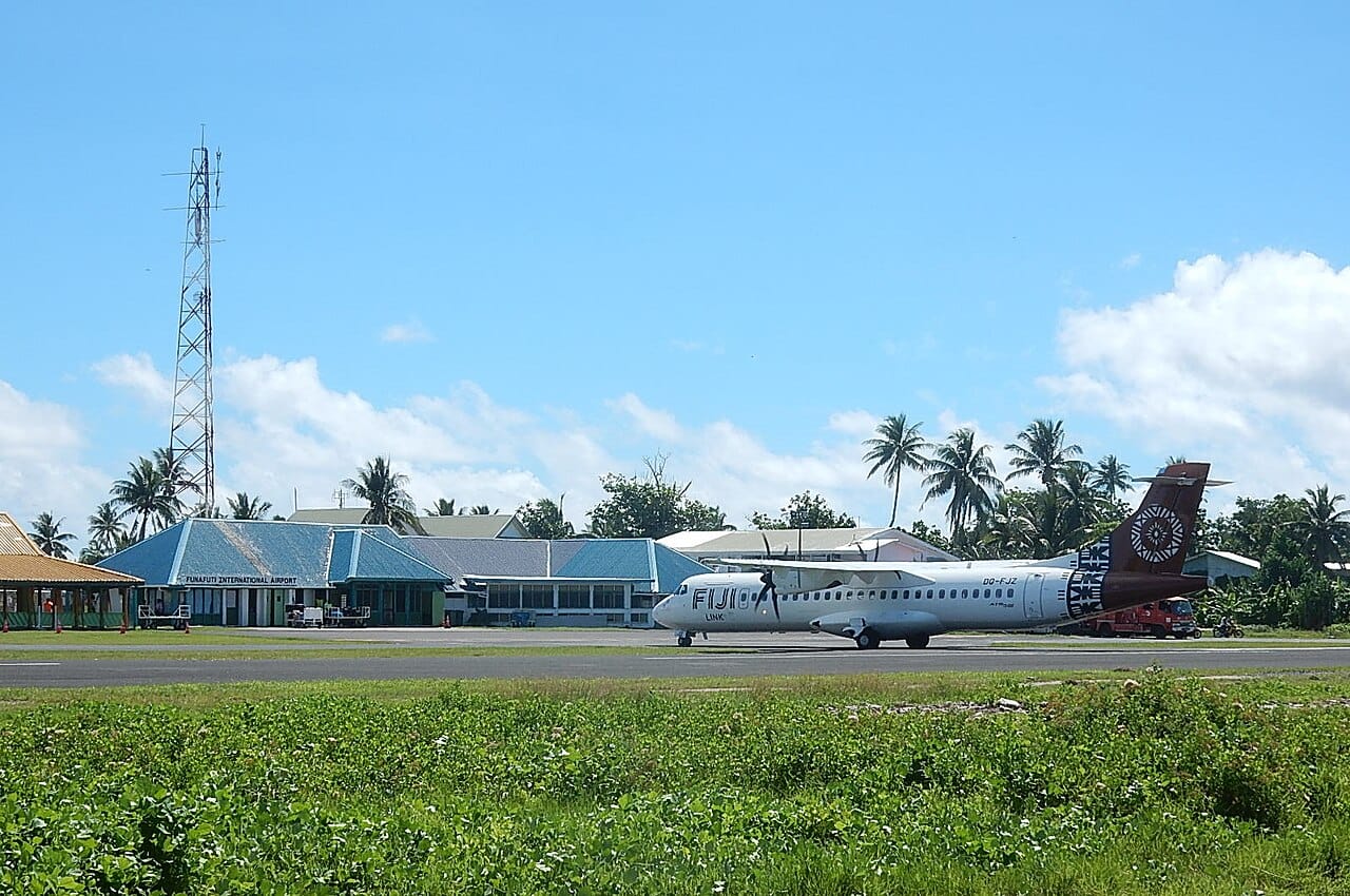 The airstrip on Funafuti, which doubles as the atoll's largest open space and a gathering place for the community. The narrow strip of land, hemmed by ocean and lagoon, captures how little ground the crowded capital of Tuvalu has to spare.