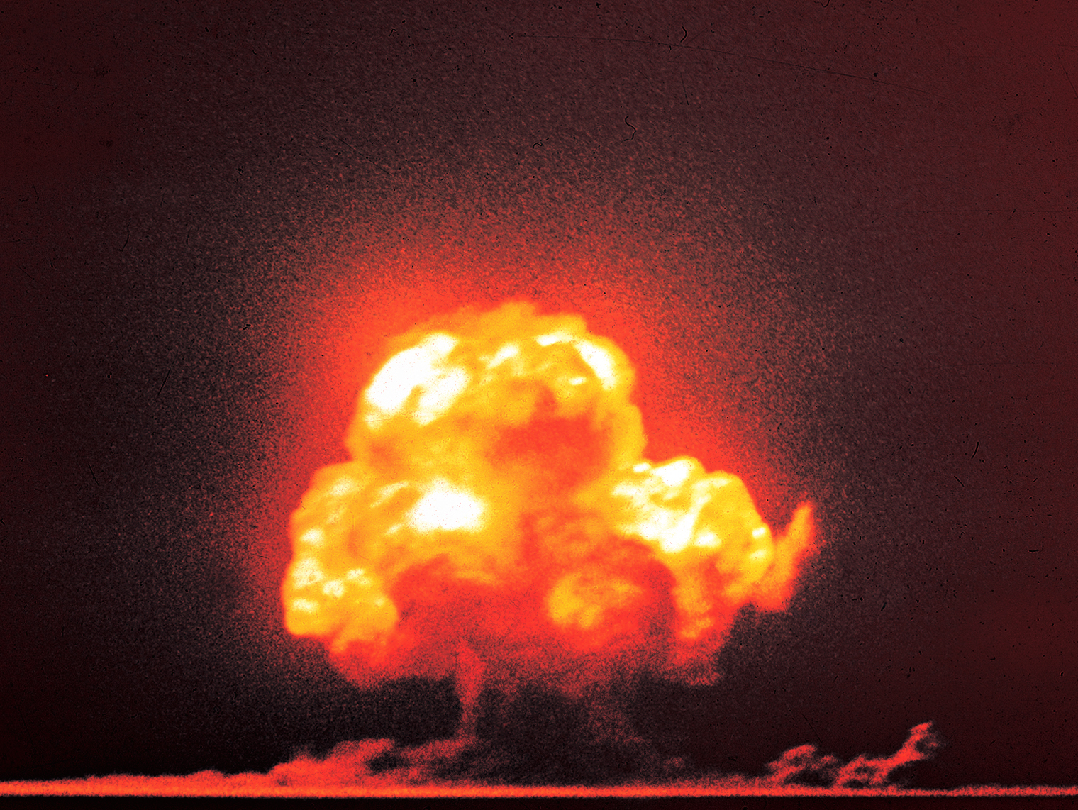 The Trinity test in New Mexico, 16 July 1945, the first detonation of a nuclear weapon. The bomb the United States built in secret ended the Second World War and opened the nuclear age.