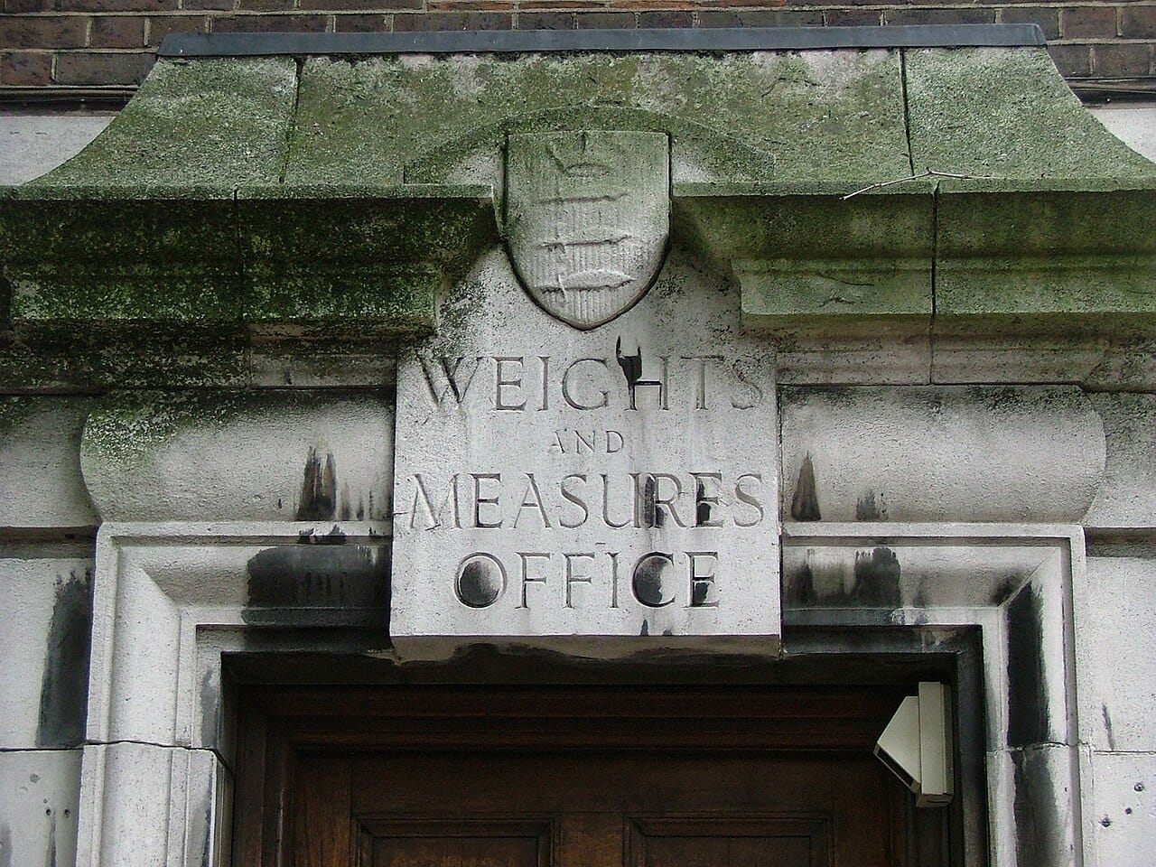 A weights and measures office. Verifying that traders' measures matched the official standard is among the oldest regulatory functions of government.