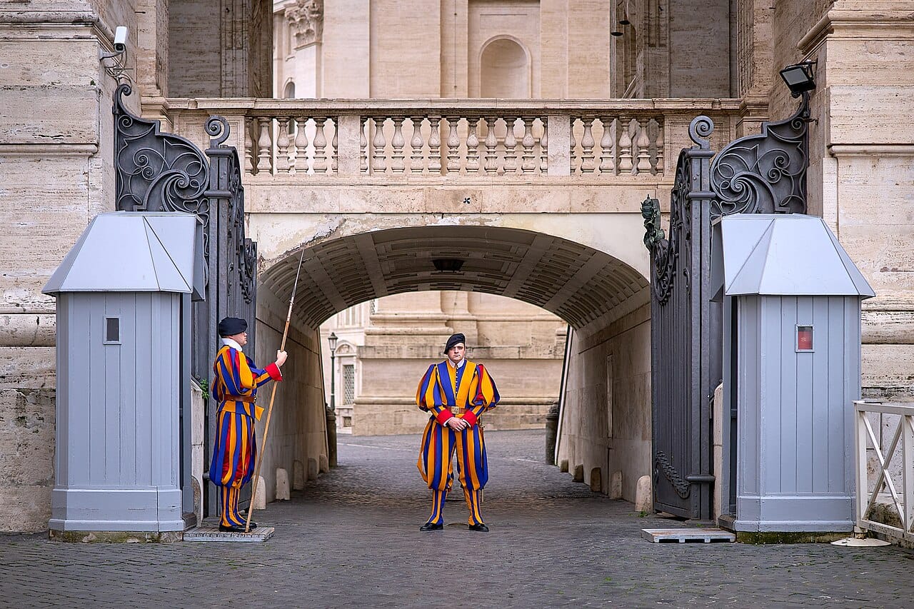 The Pontifical Swiss Guard, in service since 1506 and the smallest standing army in the world. Recruits must be Catholic, Swiss, and to have completed Swiss military training.