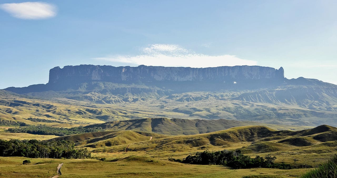 Mount Roraima, one of the ancient flat-topped tepuis of the Guiana Highlands, rising sheer from the surrounding plains. These strange, isolated table mountains, home to unique plants, inspired tales of lost worlds.
