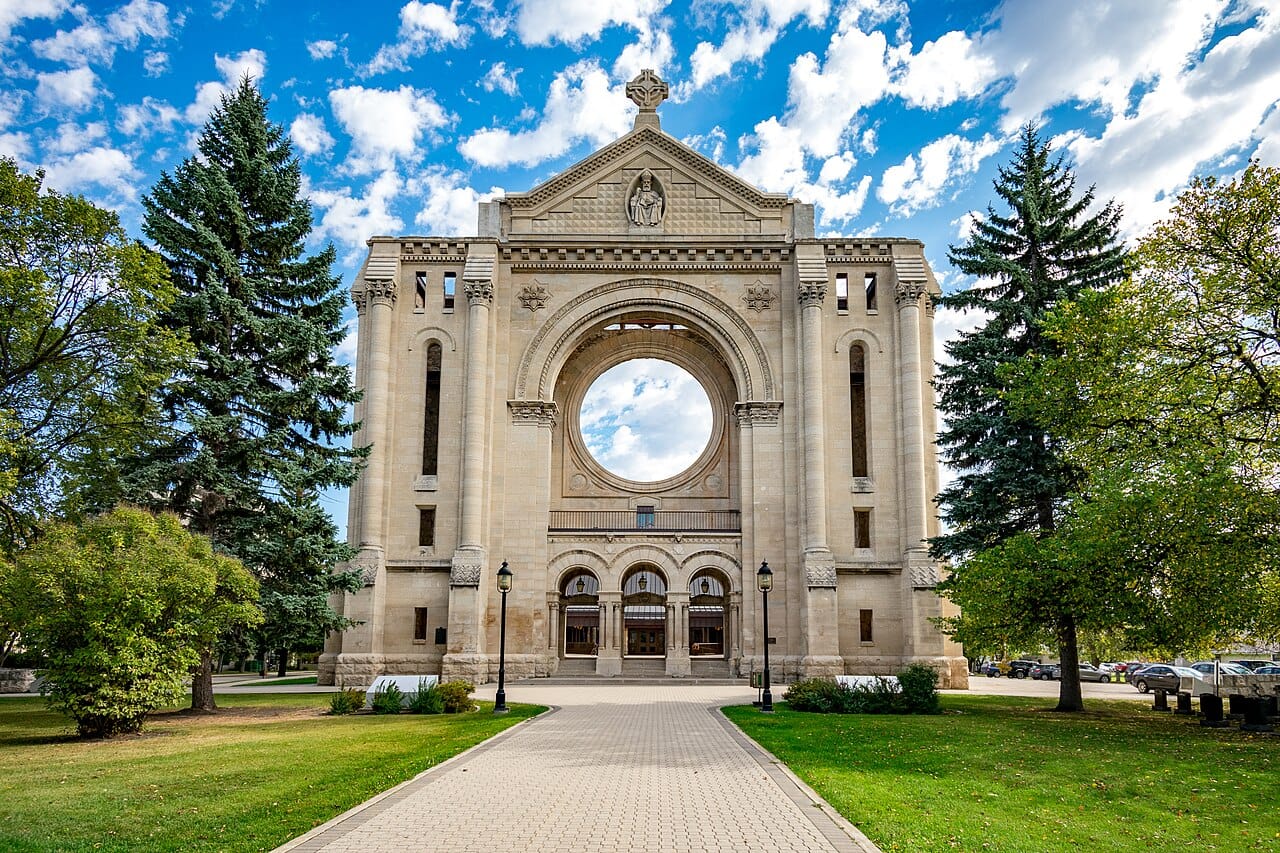 The facade of the old Saint Boniface Cathedral. The 1908 basilica burned in 1968 and the surviving stone front was incorporated into the new church, so the ruin is now the entrance.