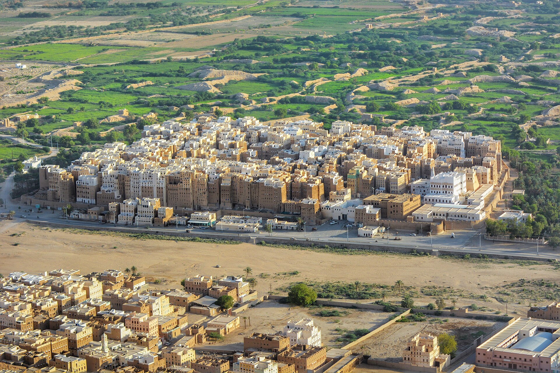 The mud-brick tower houses of Shibam in the Hadramawt valley, some rising several storeys, earning the town the nickname of the Manhattan of the desert. It is one of the oldest examples of high-rise urban planning in the world.