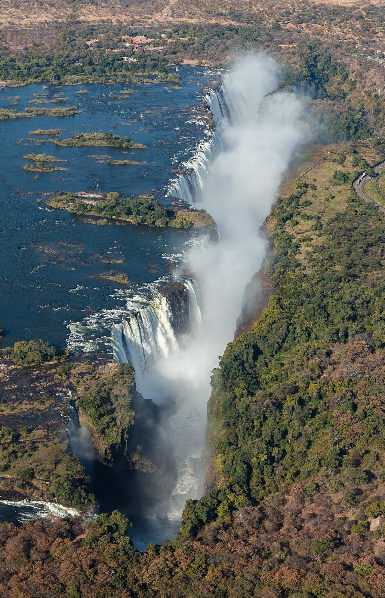 The Victoria Falls on the Zambezi, shared by Zimbabwe and Zambia, one of the largest and most spectacular waterfalls in the world. Known locally as the smoke that thunders, it is southern Africa's greatest natural wonder.